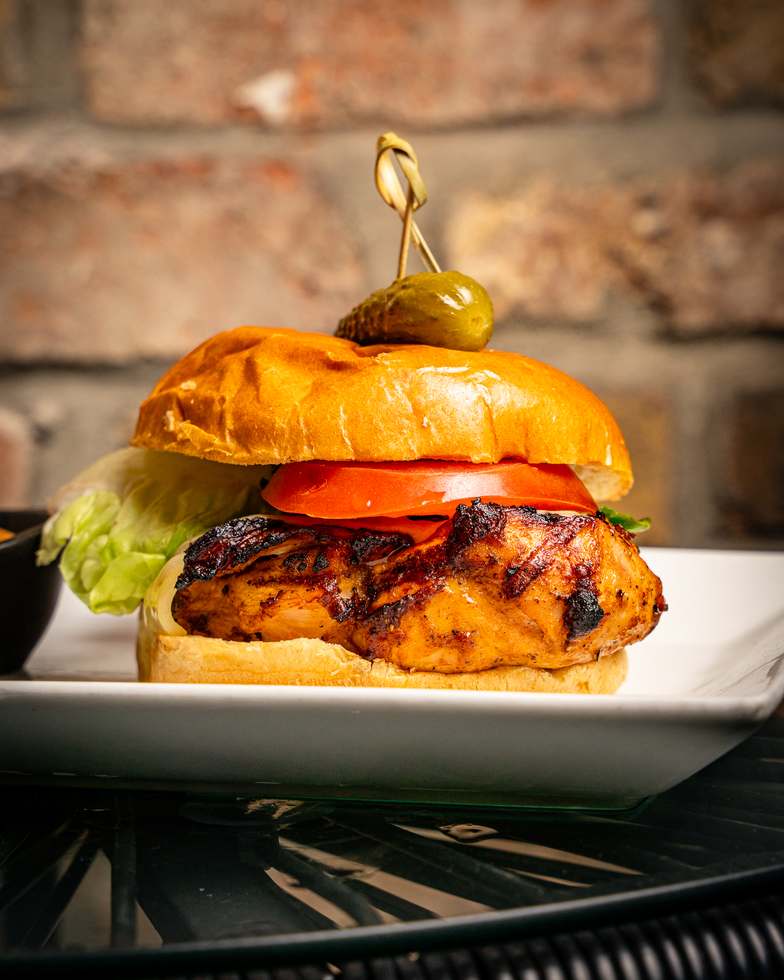 Grilled chicken burger with lettuce and tomato